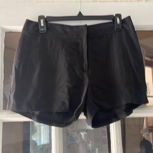 Paige Silk Shorts Size 4 Side Pockets and back pocket in Black